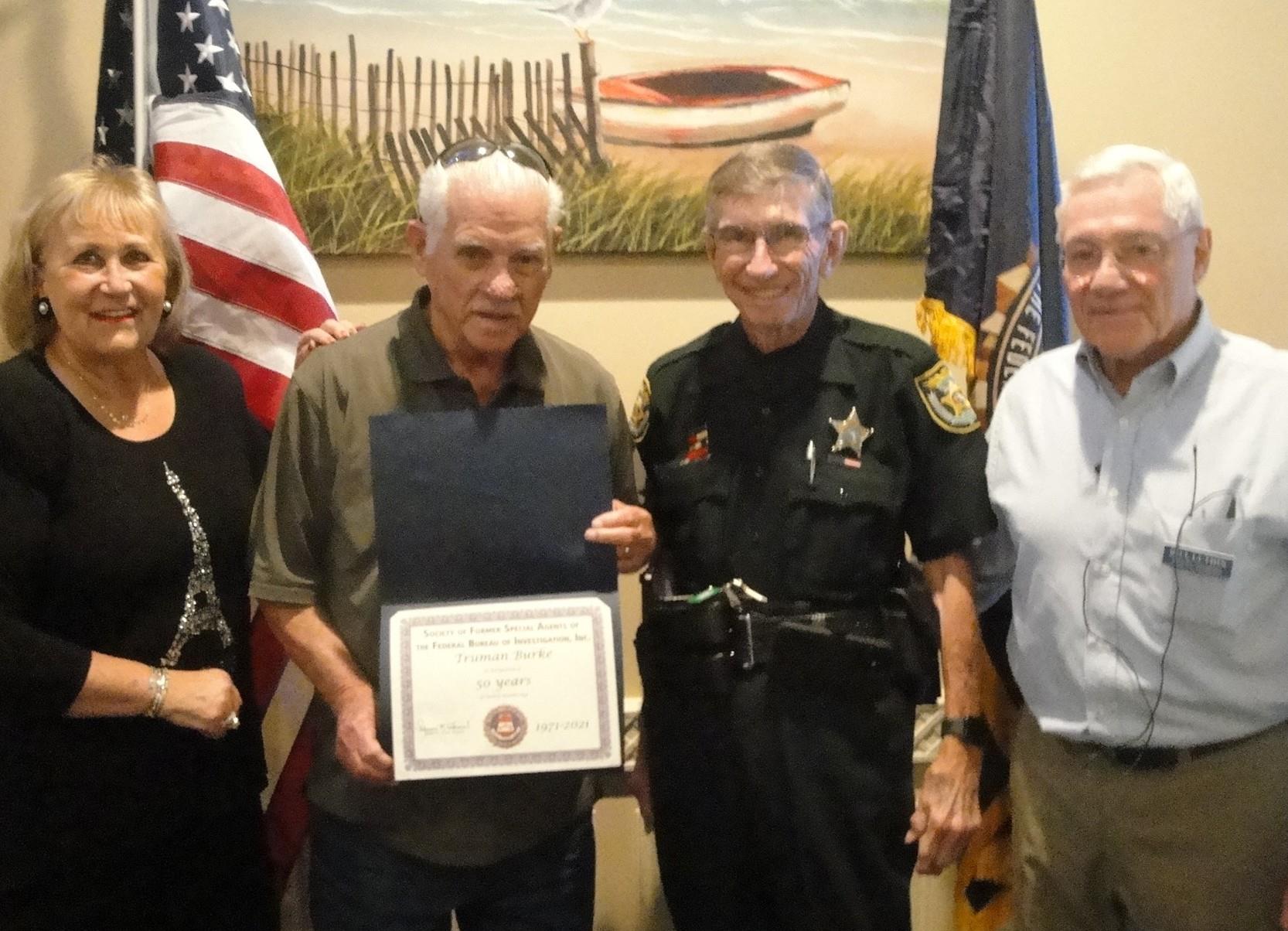 Local residents gather to honor a community member for their dedicated service and contributions.