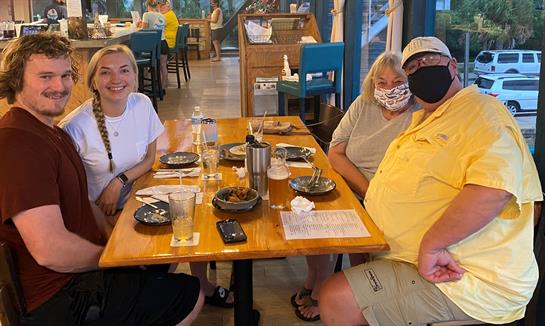 A group of people sitting at a table