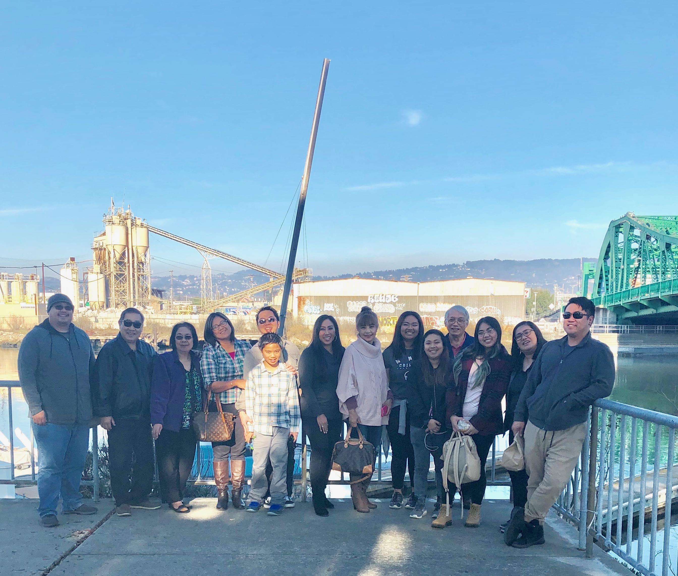 Friends and family gather by the waterfront to enjoy a sunny day and beautiful views.