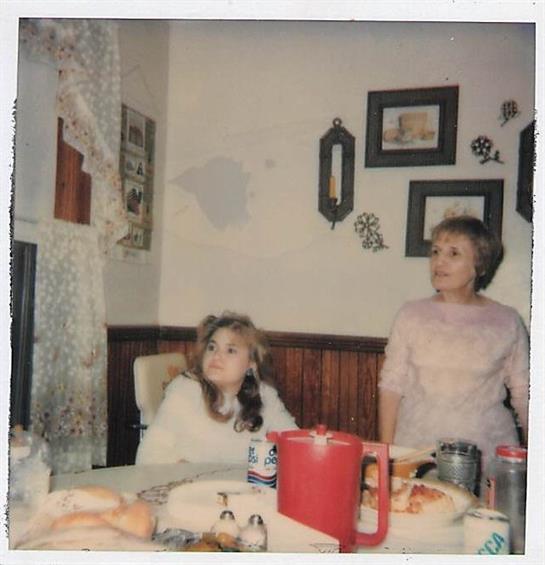 A woman and a girl sitting at a table