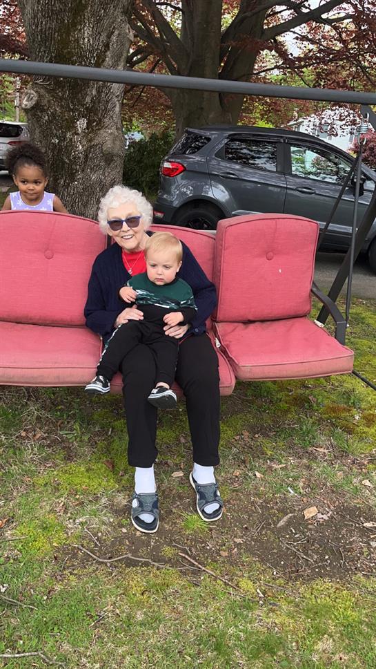 A woman and a baby on a bench