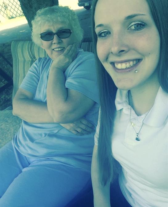 A woman sitting next to a woman