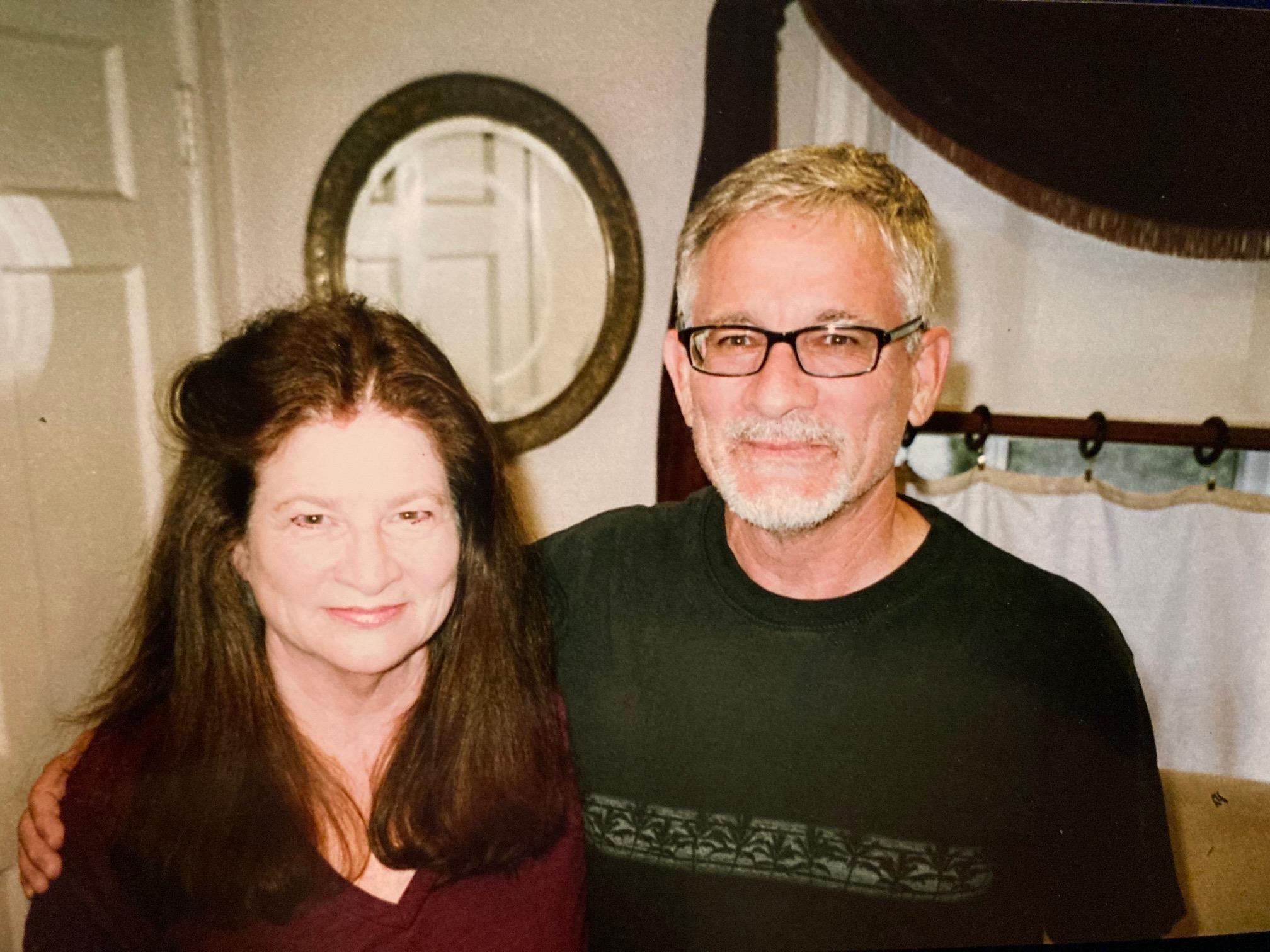 A man and woman smiling for a picture