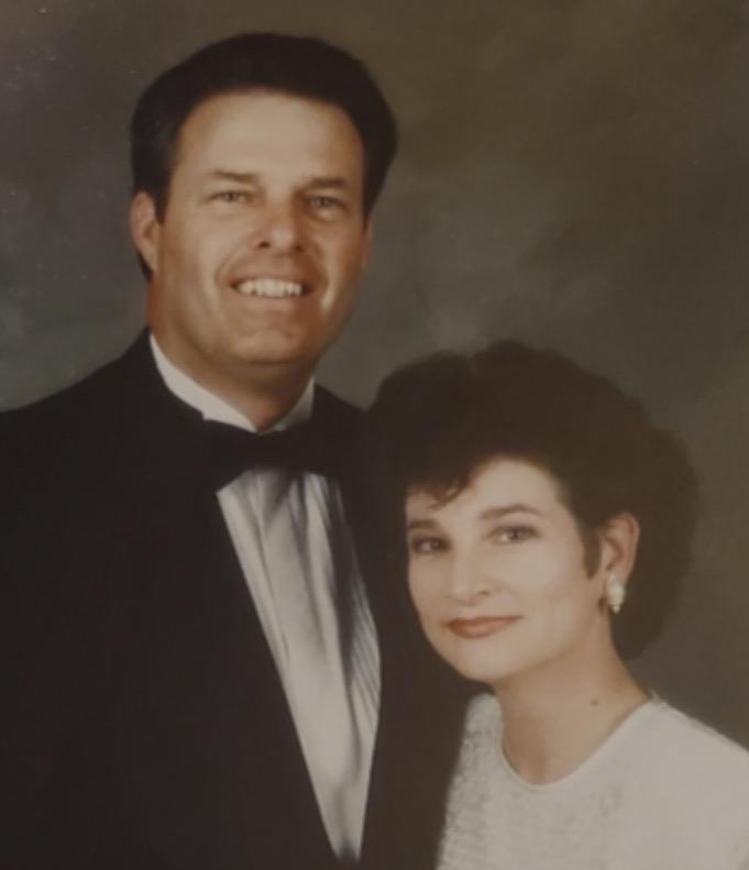 A man and woman posing for a picture
