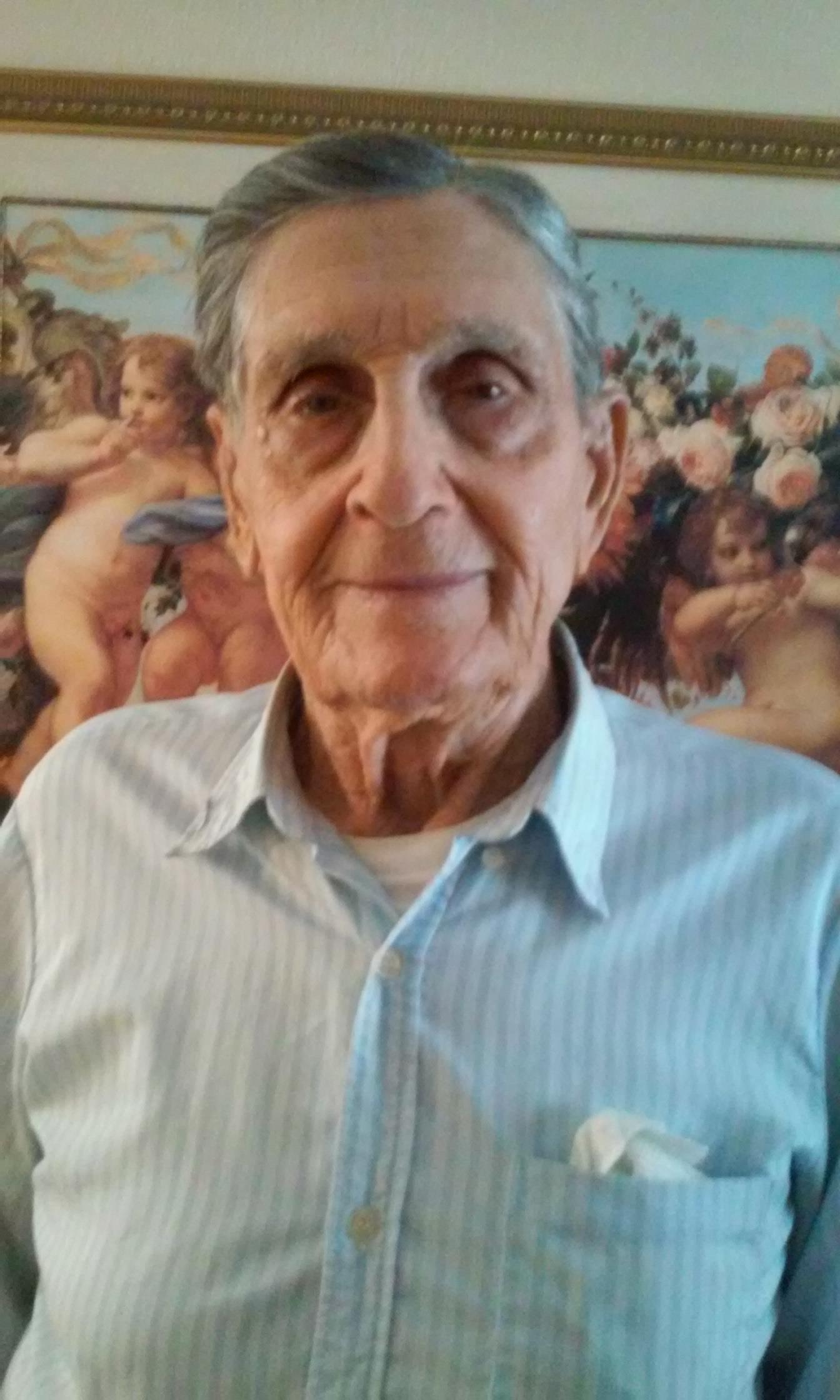 An old man in a blue shirt