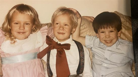 A group of children posing for a picture