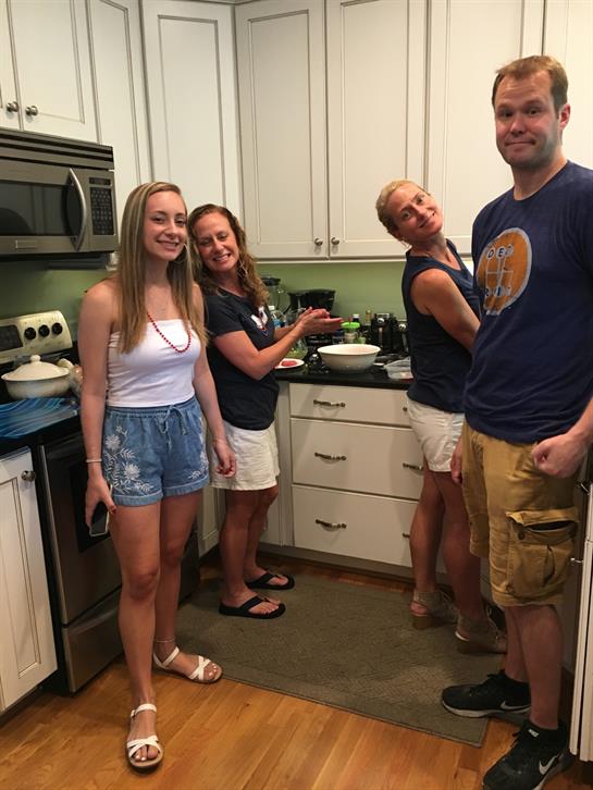A group of people in a kitchen