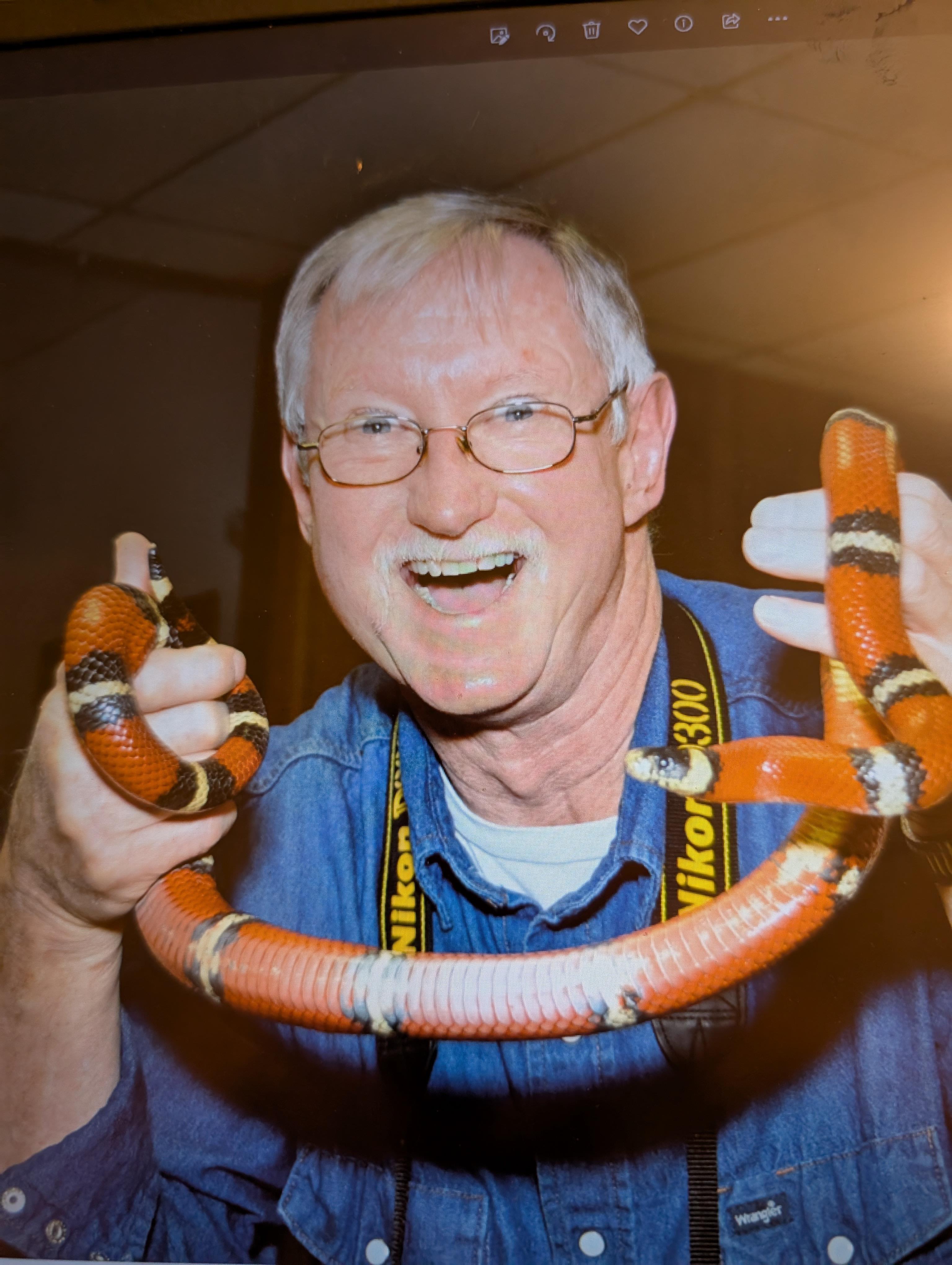 A man holding a snake