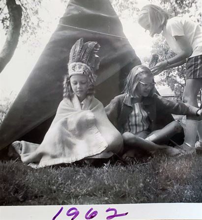 A group of girls sitting in a teepee