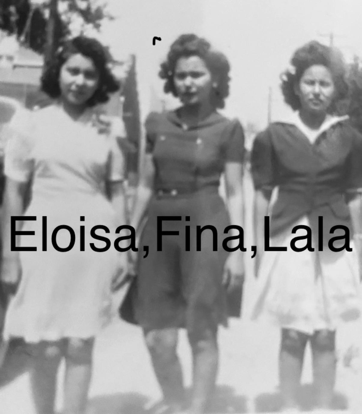 A group of women standing on a street