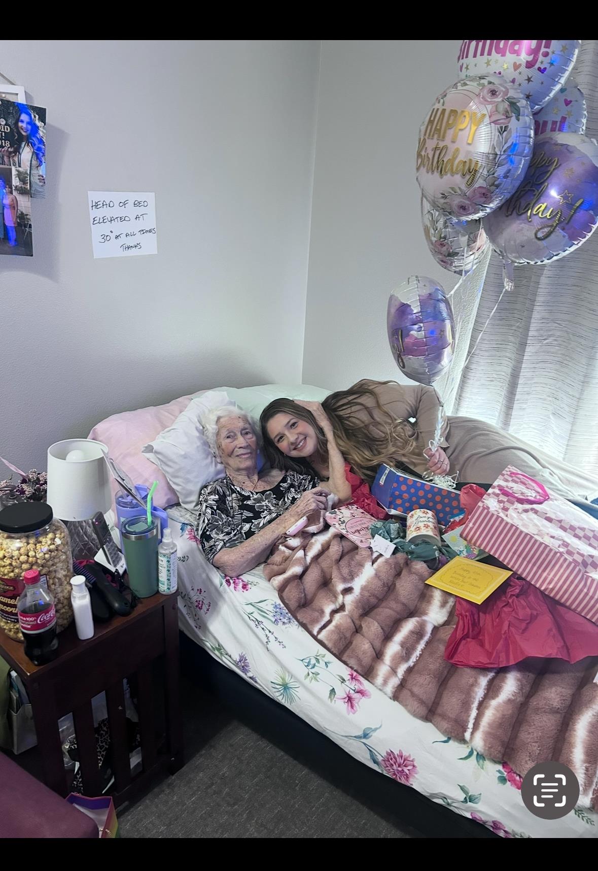 Family members gather in a warm room to celebrate an important occasion with joy and laughter.