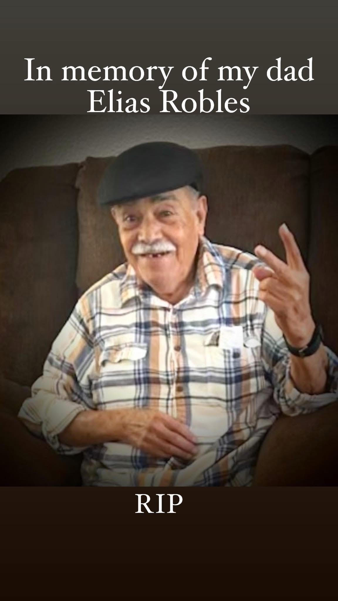 Senior man shares a joyful moment indoors while comfortably dressed.