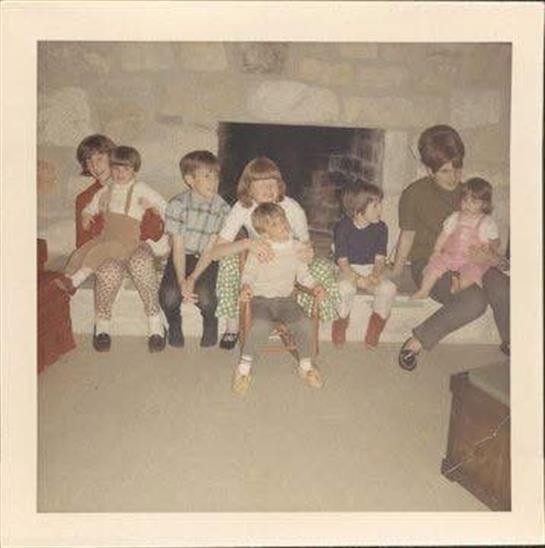 A group of children sitting on a bench
