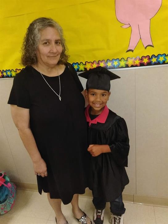 A woman and a child posing for a picture