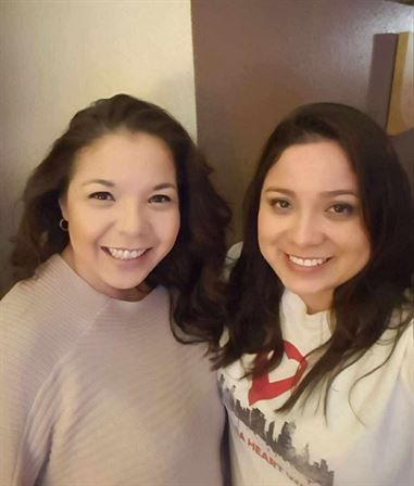 Two women smiling at the camera