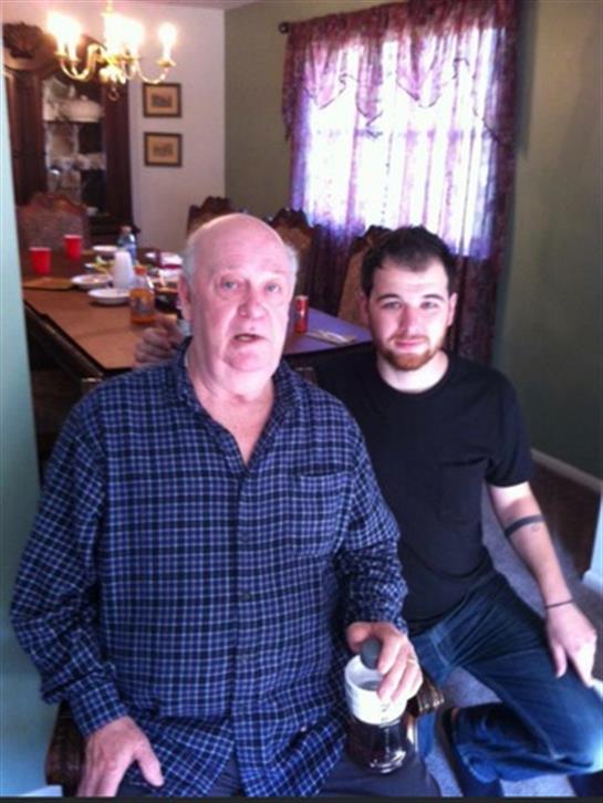 A man and a man sitting in a room