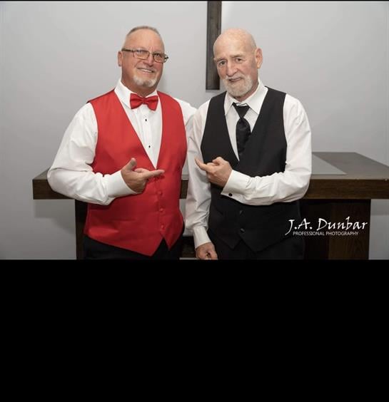 Two men standing next to each other