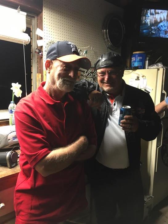 Two men standing together smiling