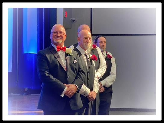 A group of men in suits