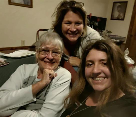A group of women smiling for a photo