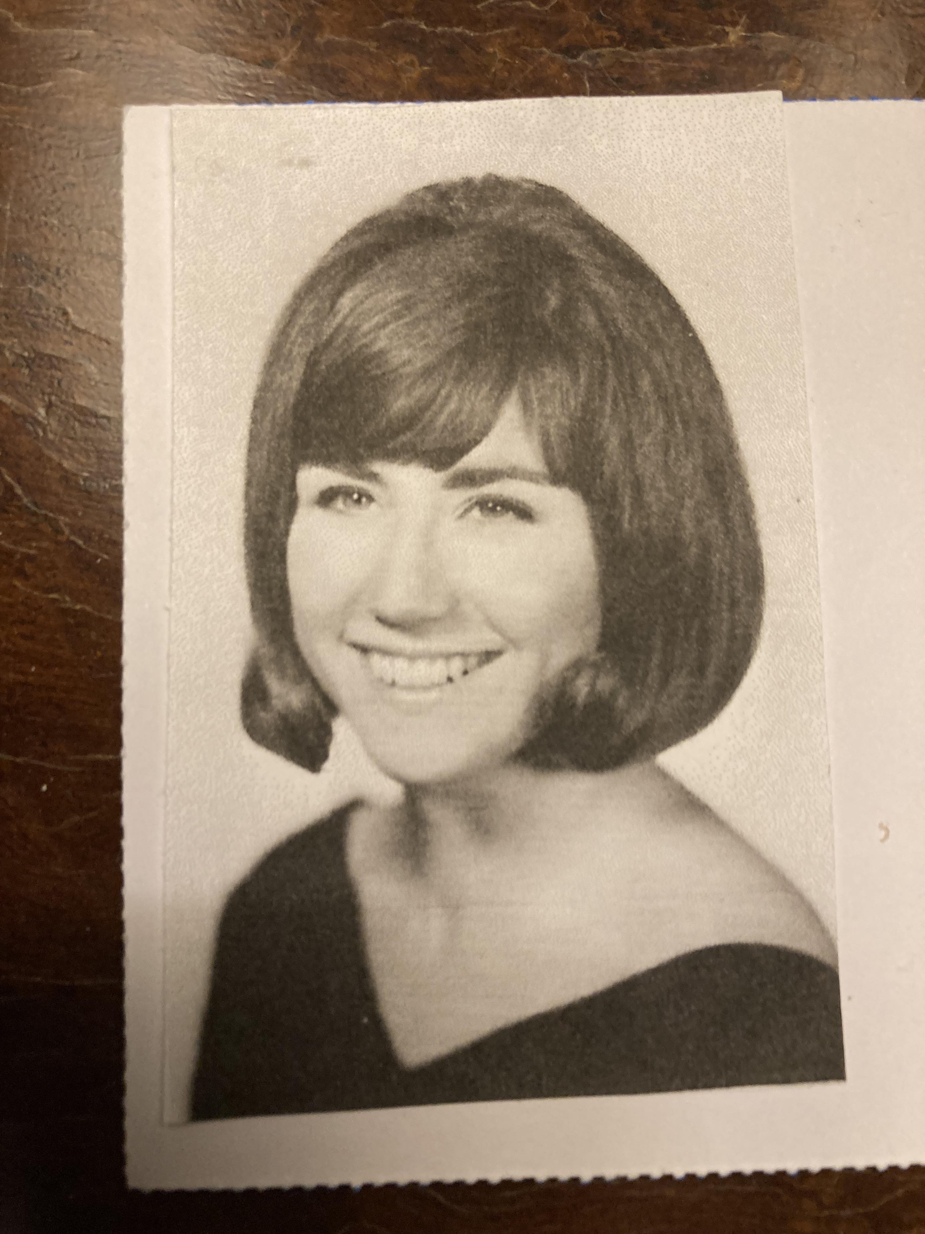 A woman with short hair smiling