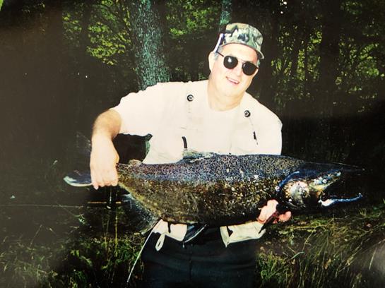 A man holding a large fish