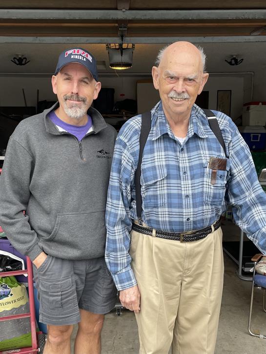 Two men standing next to each other