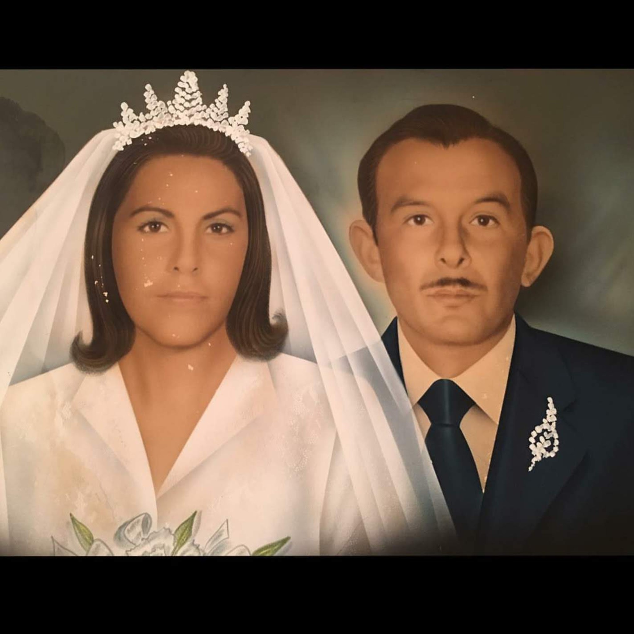 A man and woman in wedding attire