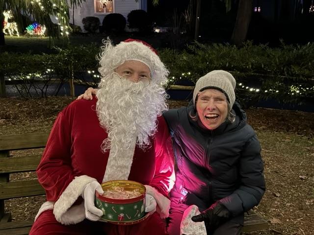 A man in a garment with a woman in a park