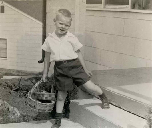 A boy holding a basket