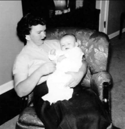 A woman holding a baby