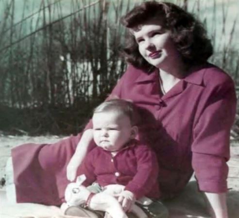 A woman holding a baby