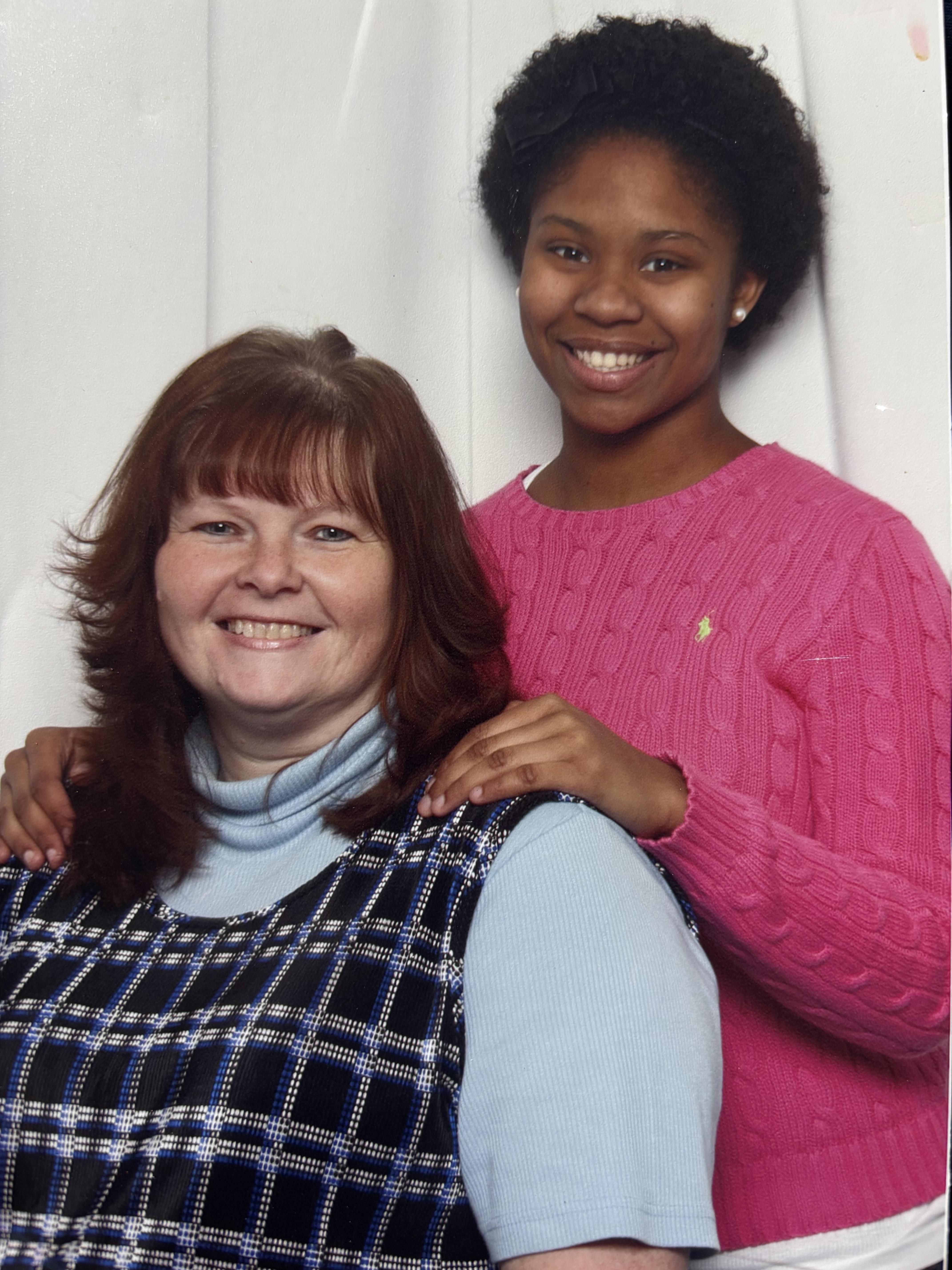 A woman and a young woman smiling