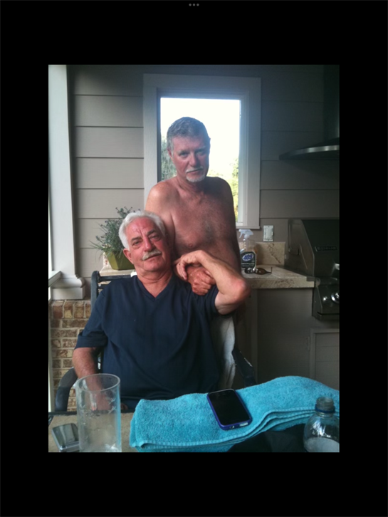 Two men sitting in a chair
