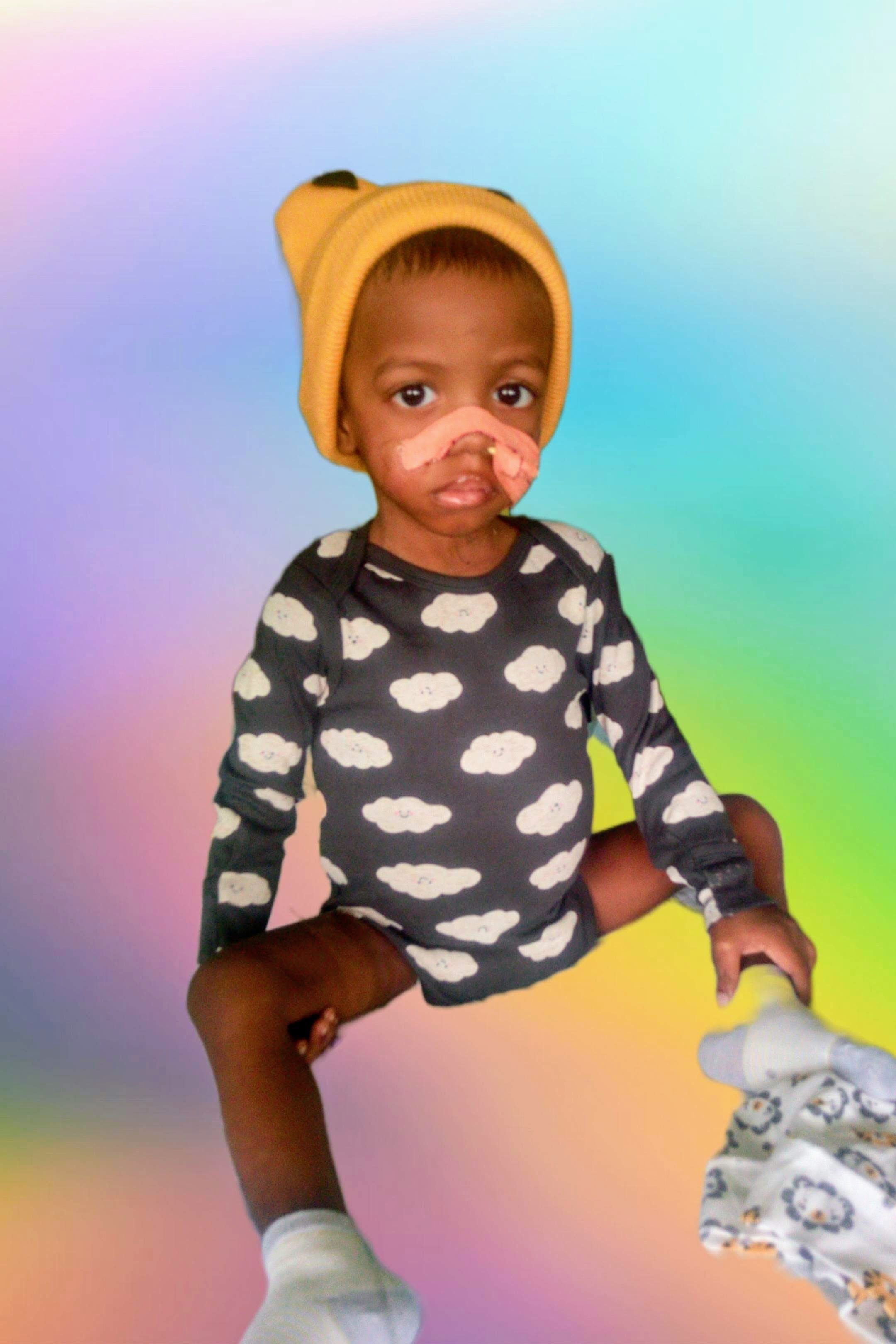 A child with a nose and nose ring