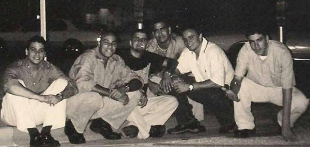 A group of men posing for a picture