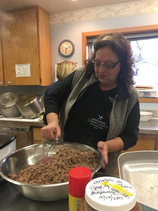 A woman mixing food in a bowl