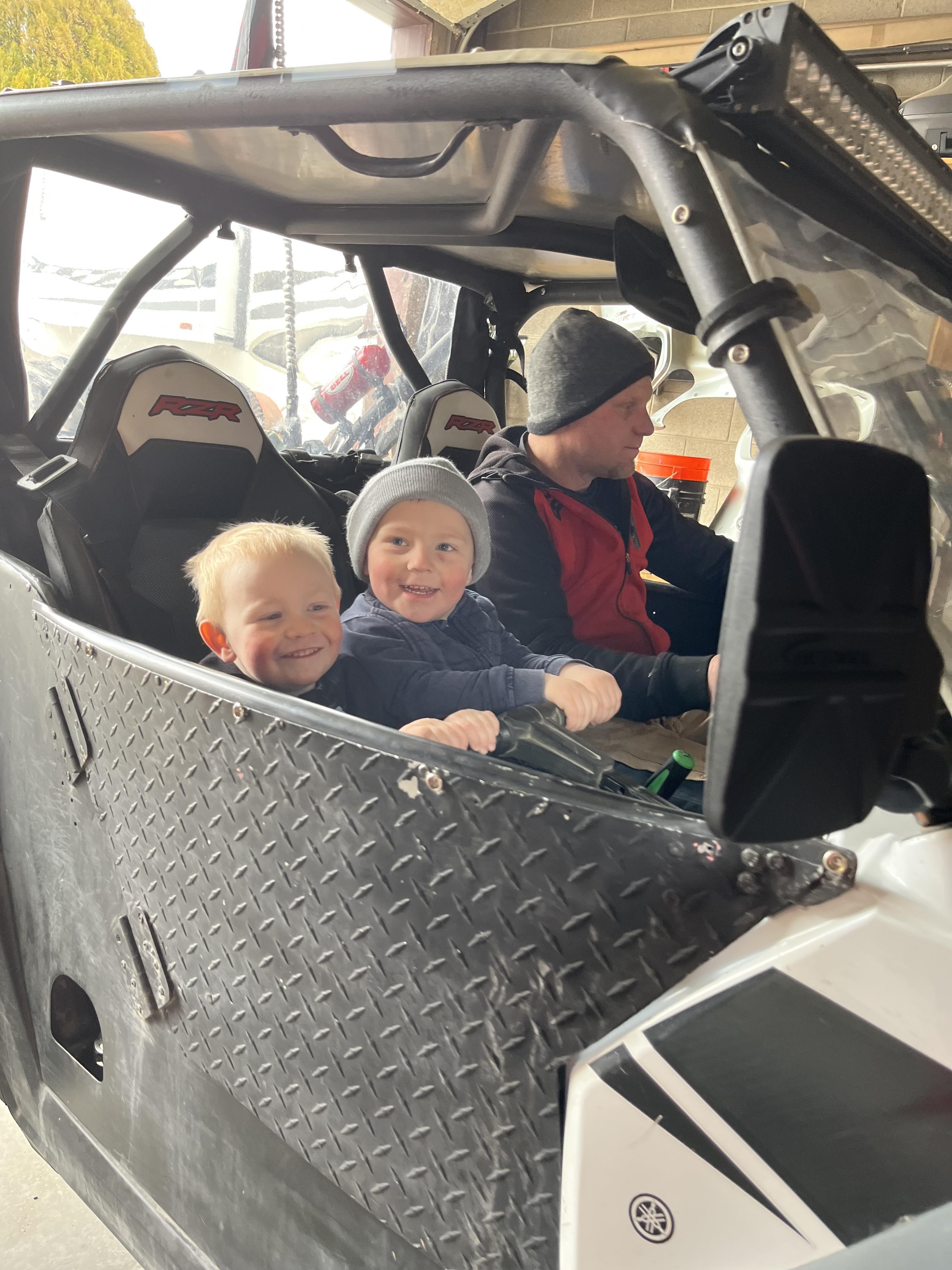 A group of kids in a vehicle