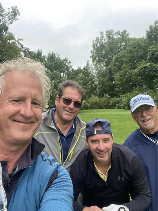 A group of men taking a selfie