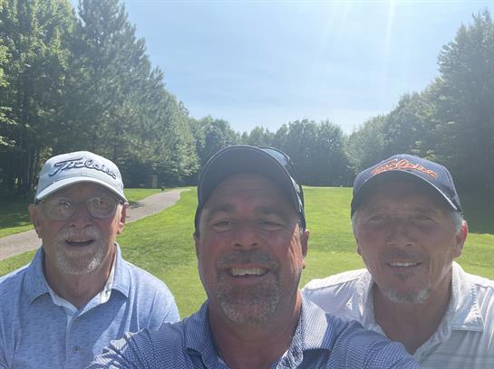 A group of men taking a selfie