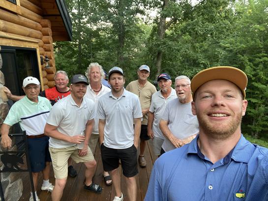 A group of men standing on a deck