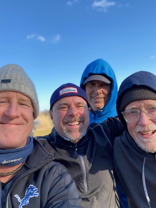 A group of men taking a selfie