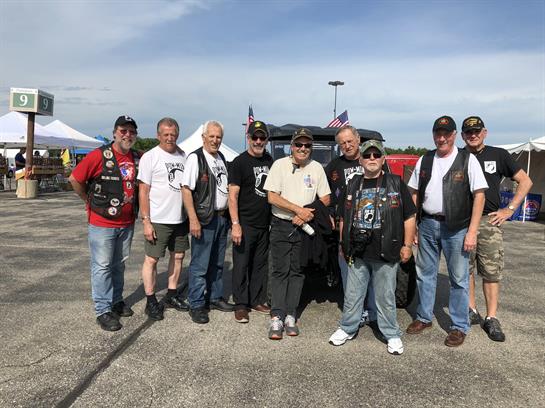 A group of men posing for a photo