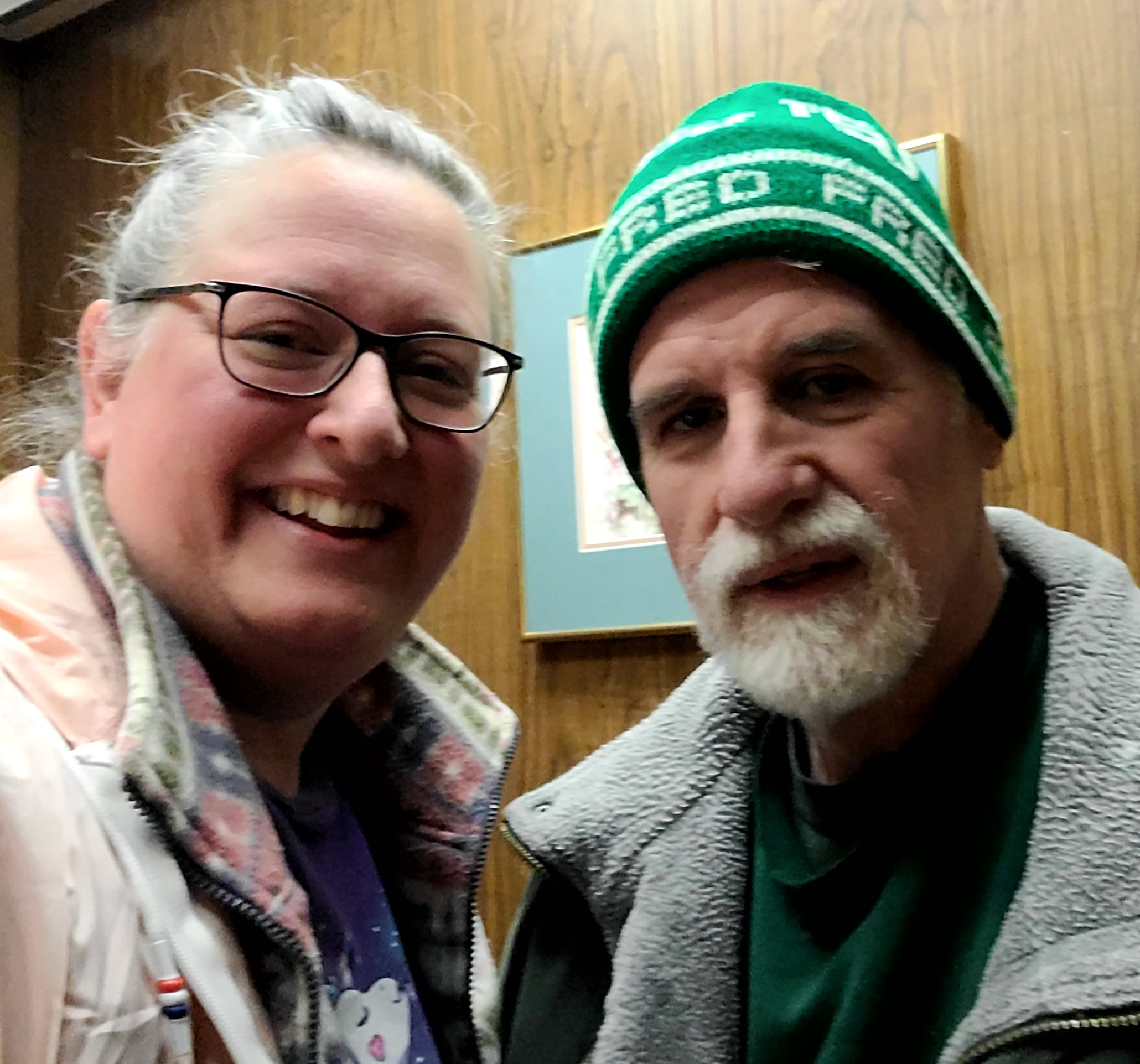 A man and woman smiling for a picture