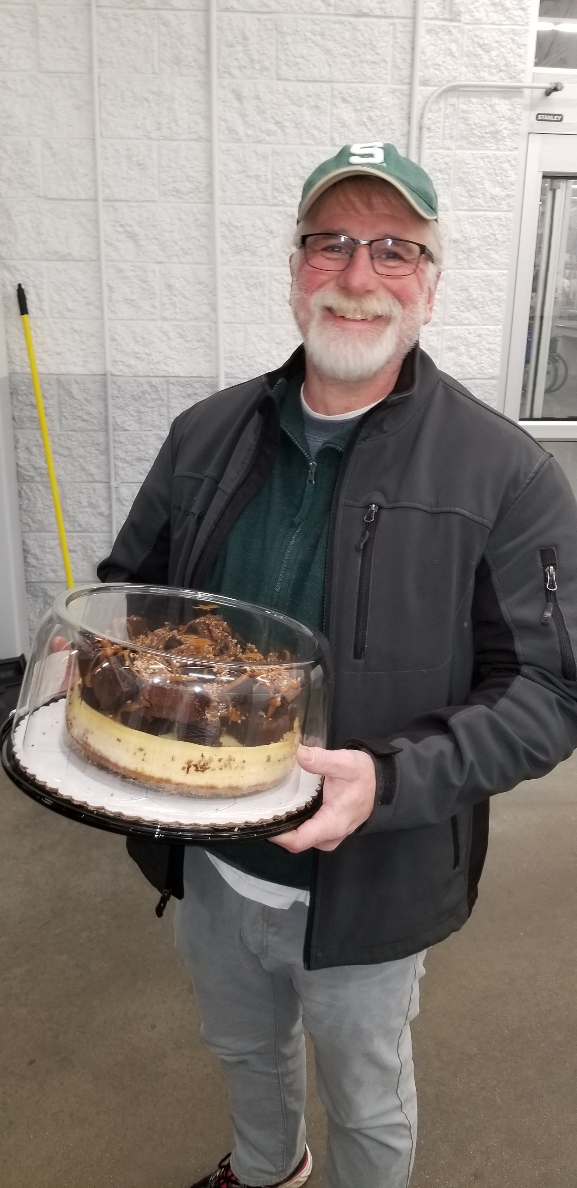 A man holding a cake