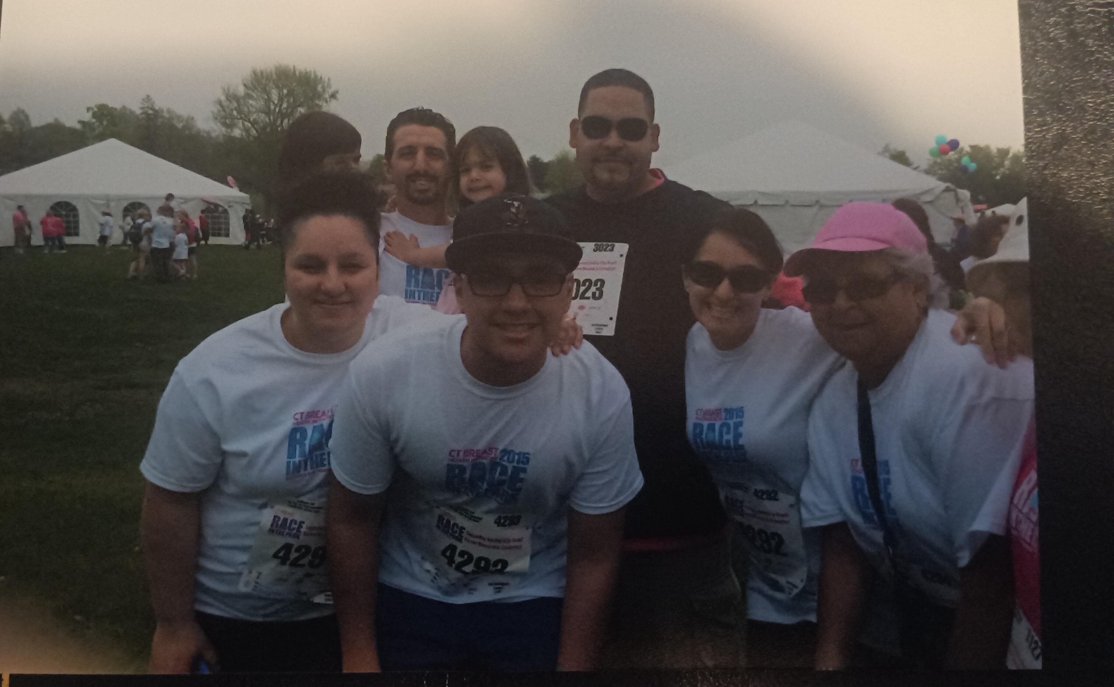 A group of people wearing matching t-shirts