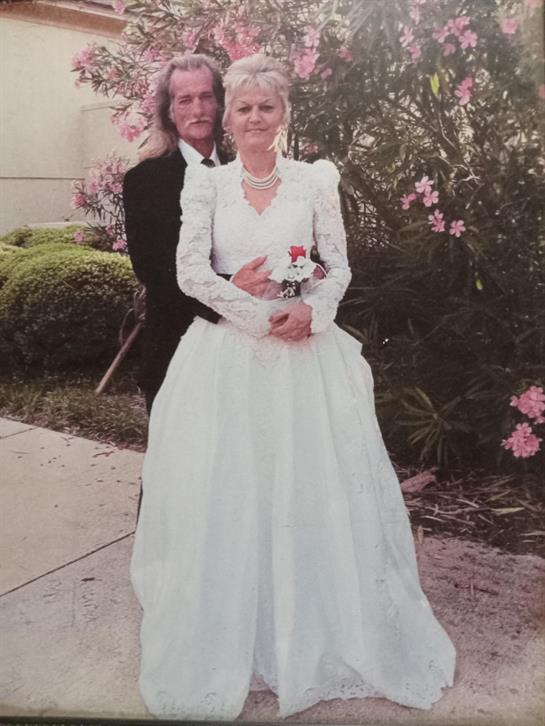 A man and woman in a wedding dress
