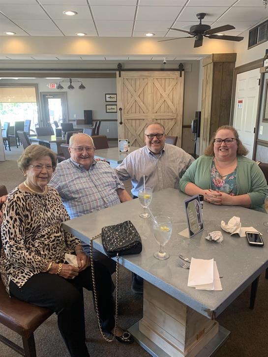 A group of people sitting at a table