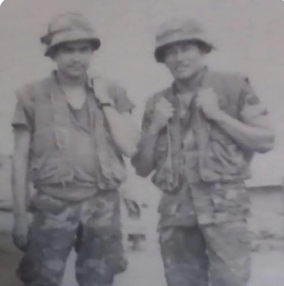 A couple of men wearing military uniforms