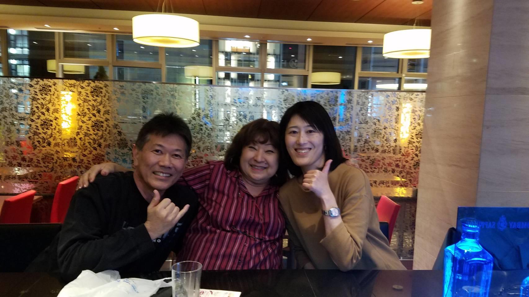 A group of people sitting at a table